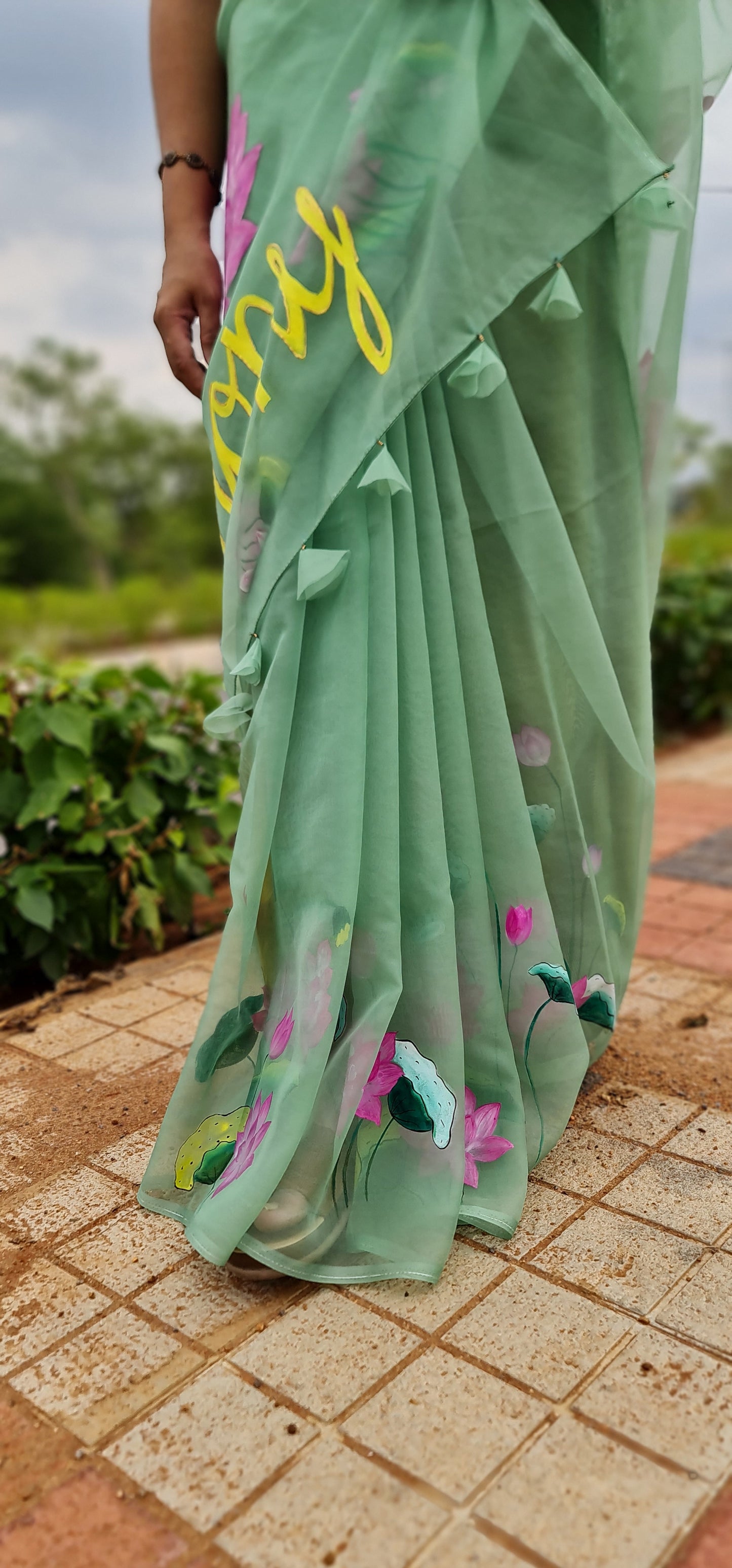 Pastel green,Lotus handpainted organza saree