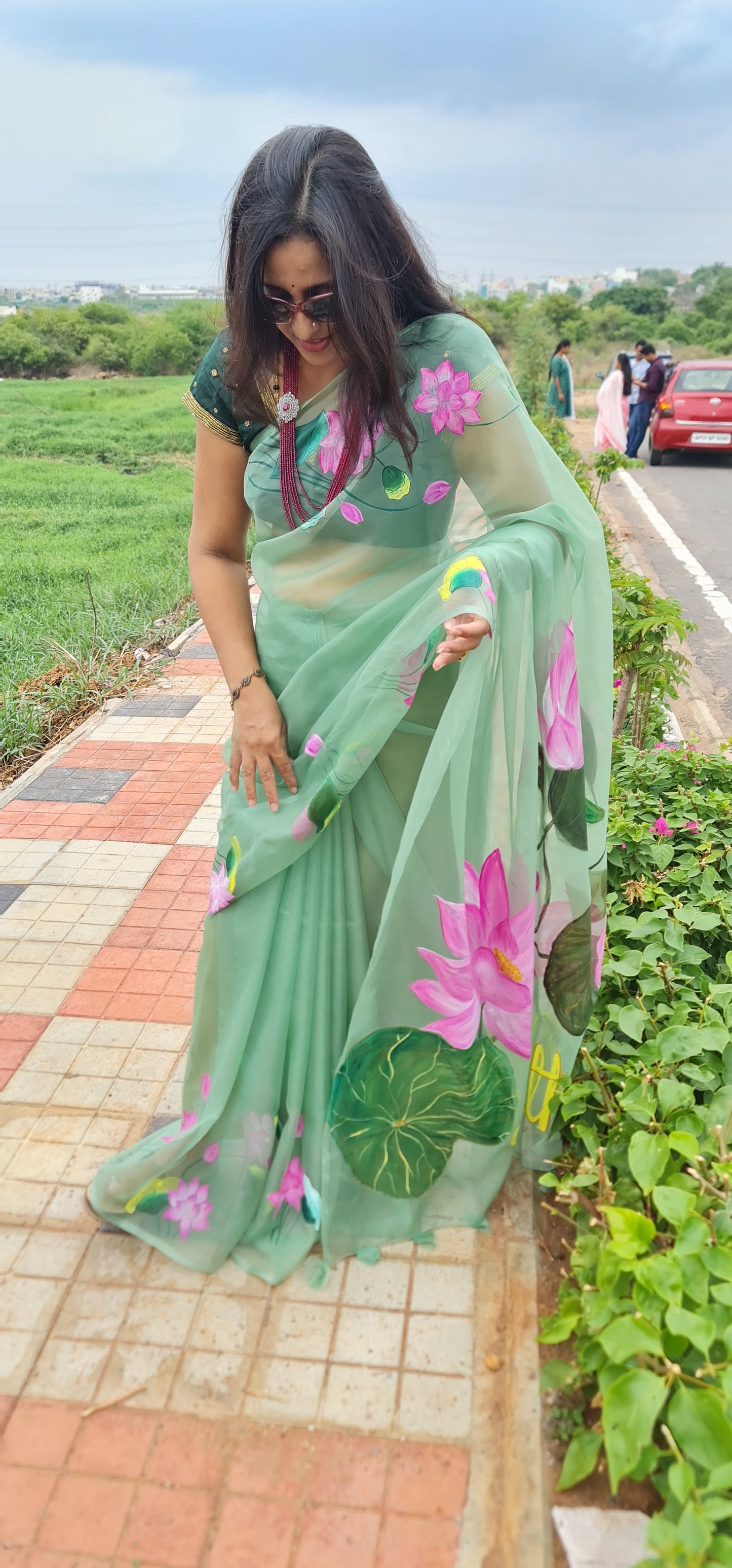 Pastel green,Lotus handpainted organza saree