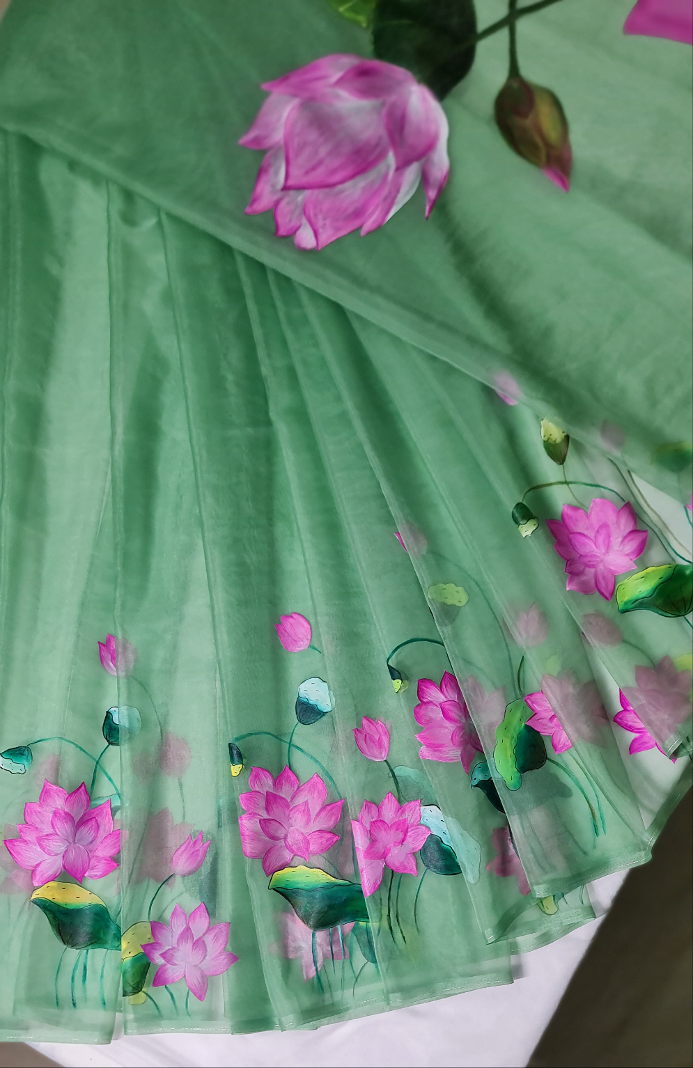 Pastel green,Lotus handpainted organza saree